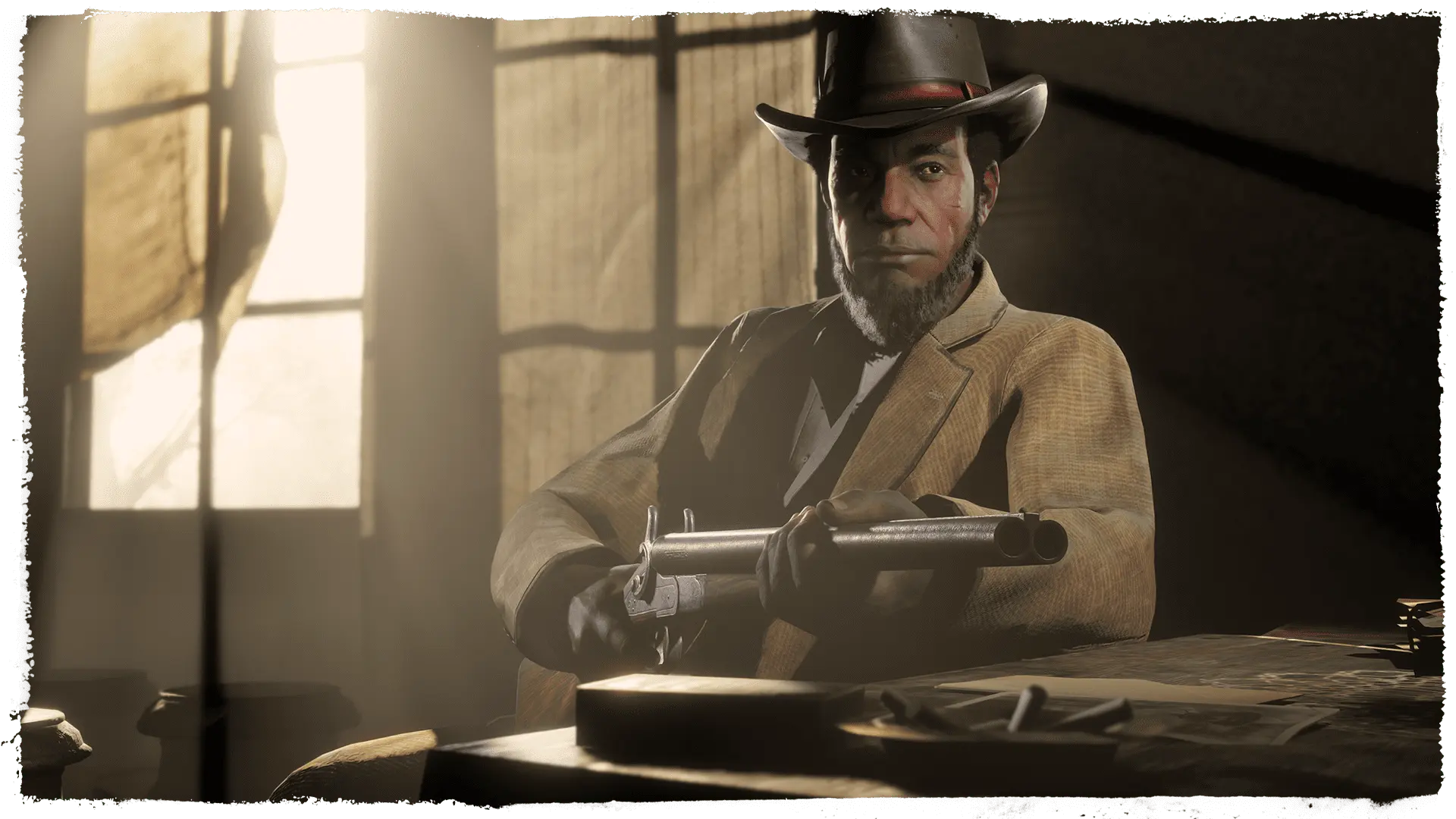 A hatted outlaw sits at a table holding a gun in a room lit by a window.