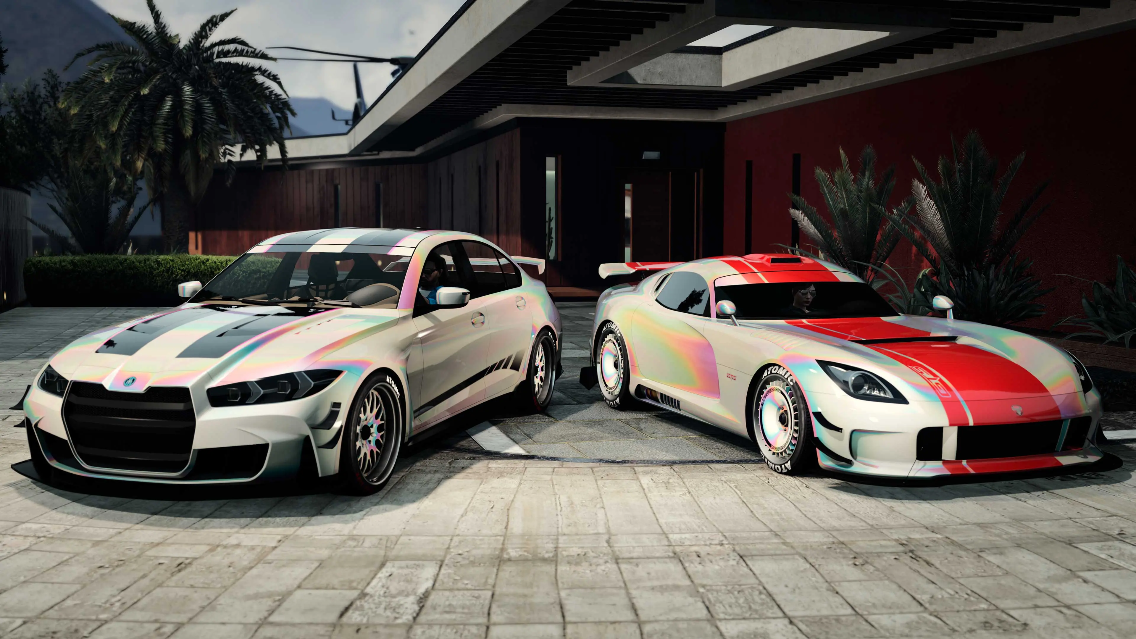 Two cars painted in Cream Pearl Chameleon parked outside a luxury home.