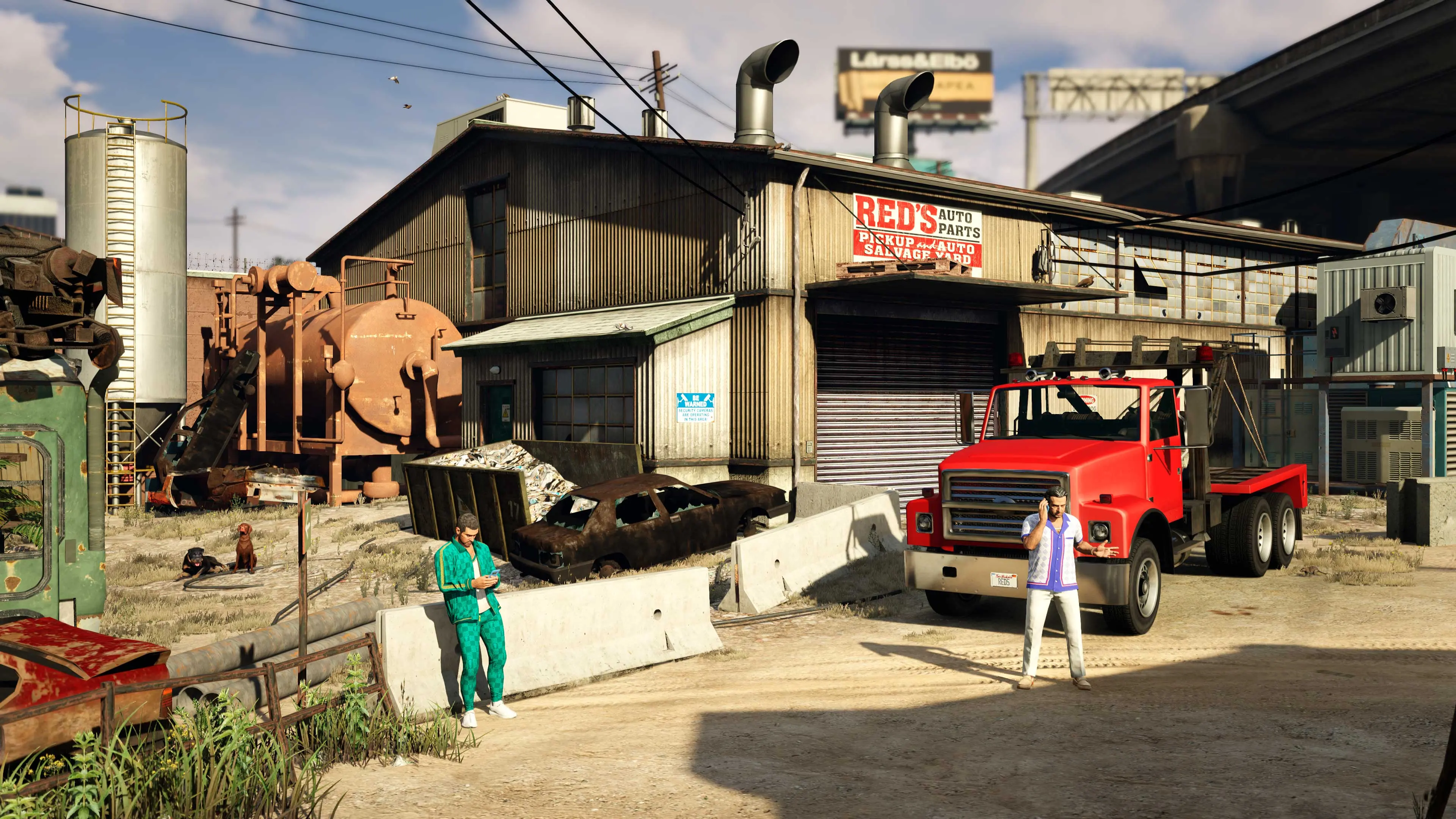 Yusuf and Jamal Amir on their phones at the Red's Auto Parts Salvage Yard.