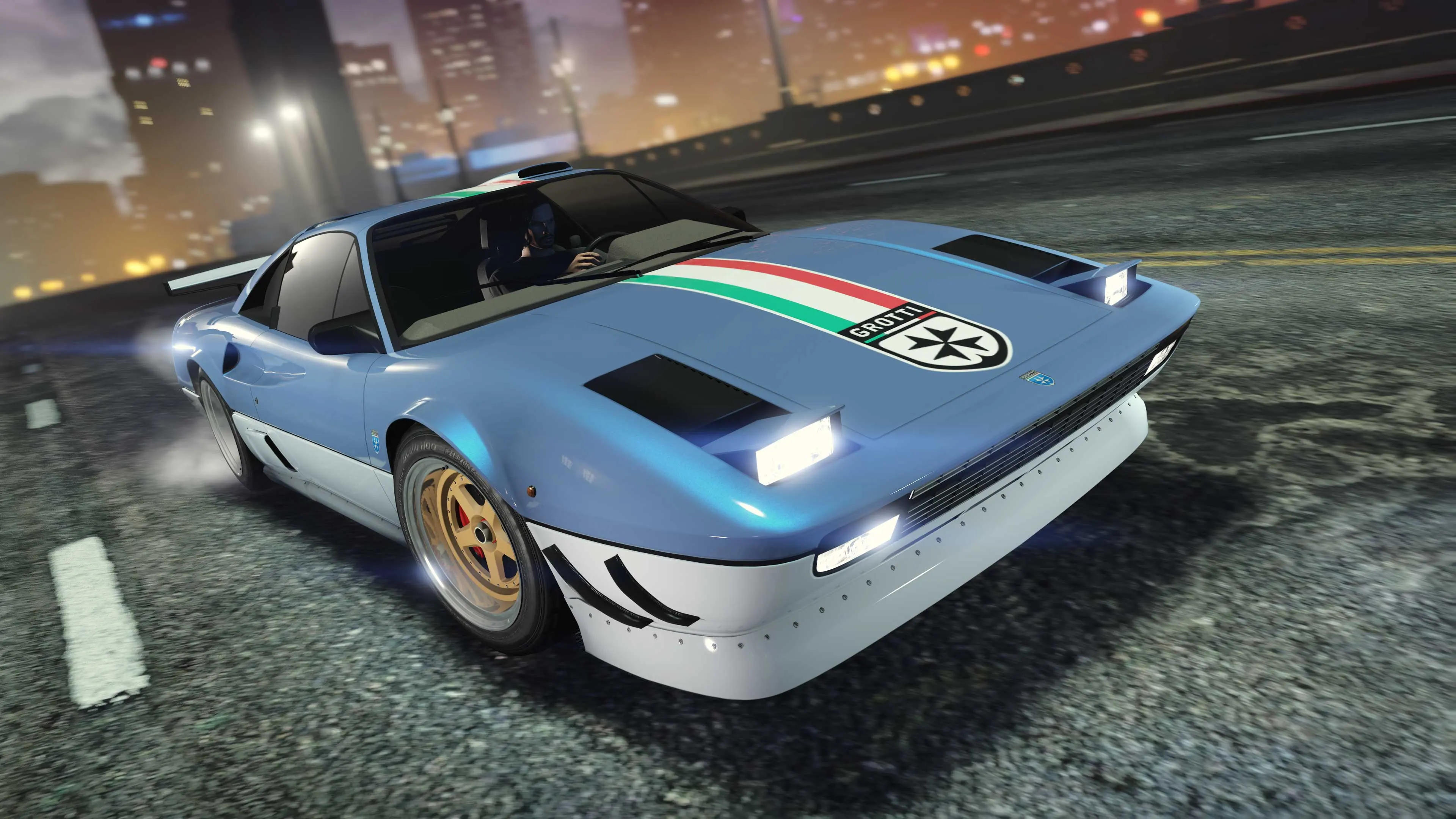 A blue Grotti Itali Classic with a red, white and green stripe and the Grotti badge on the hood.