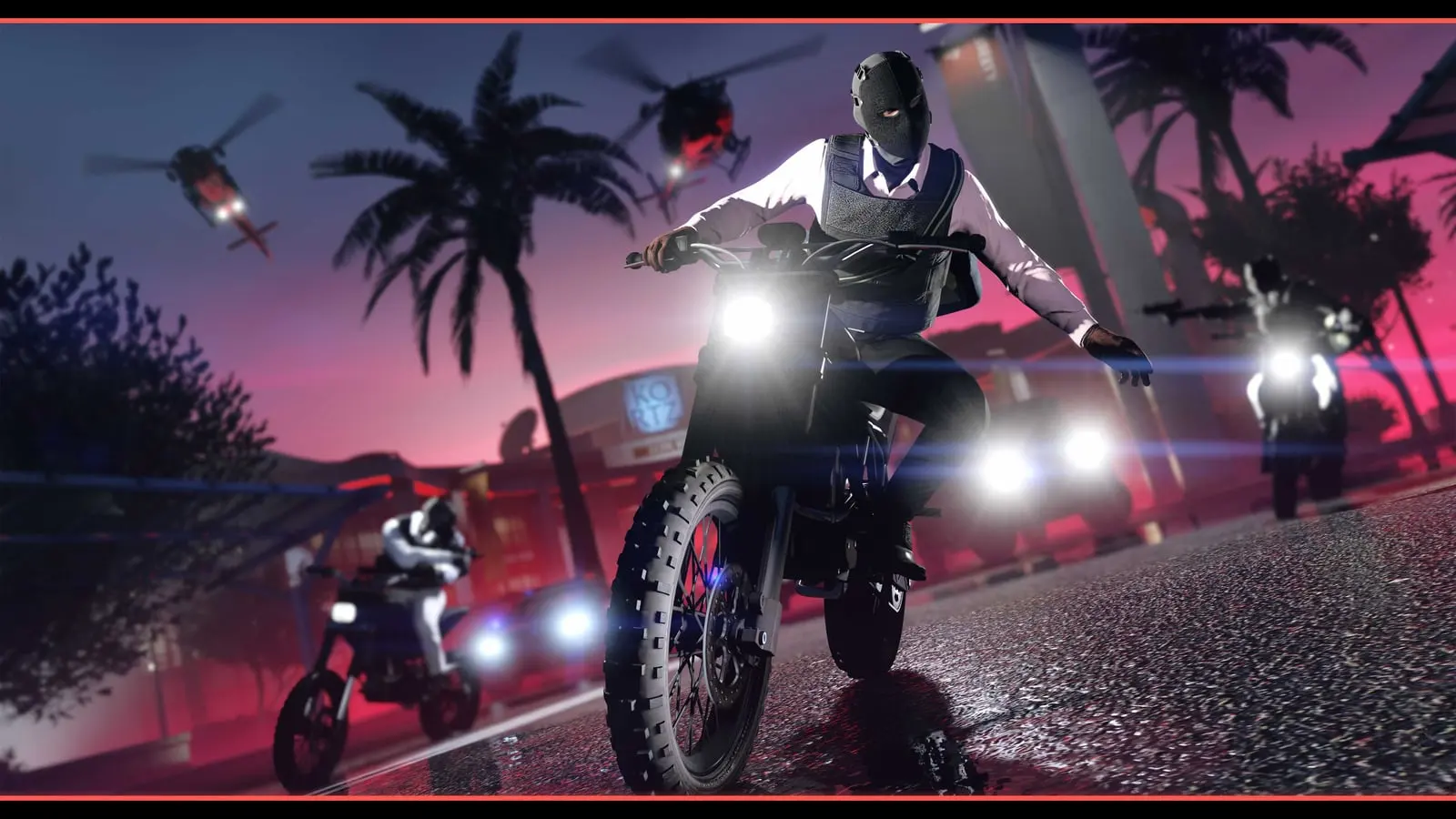 GTA Online characters escaping on motorcycles at night down a palm-lined street with a helicopter in pursuit.