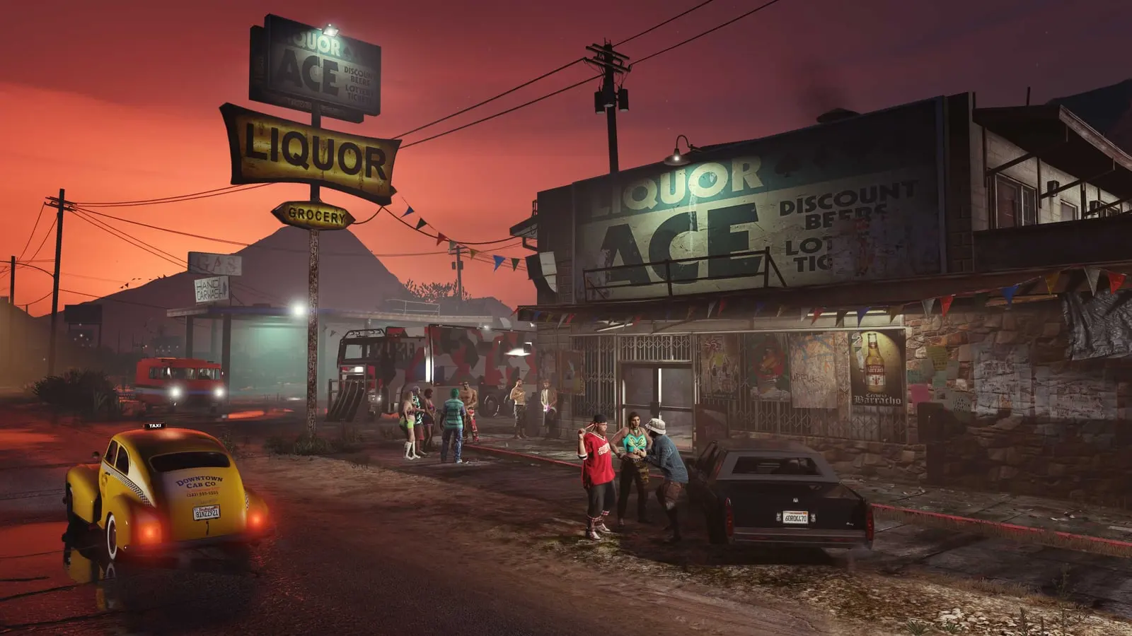 The Liquor Ace storefront in Sandy Shores at dusk, with several characters and a yellow car parked outside.