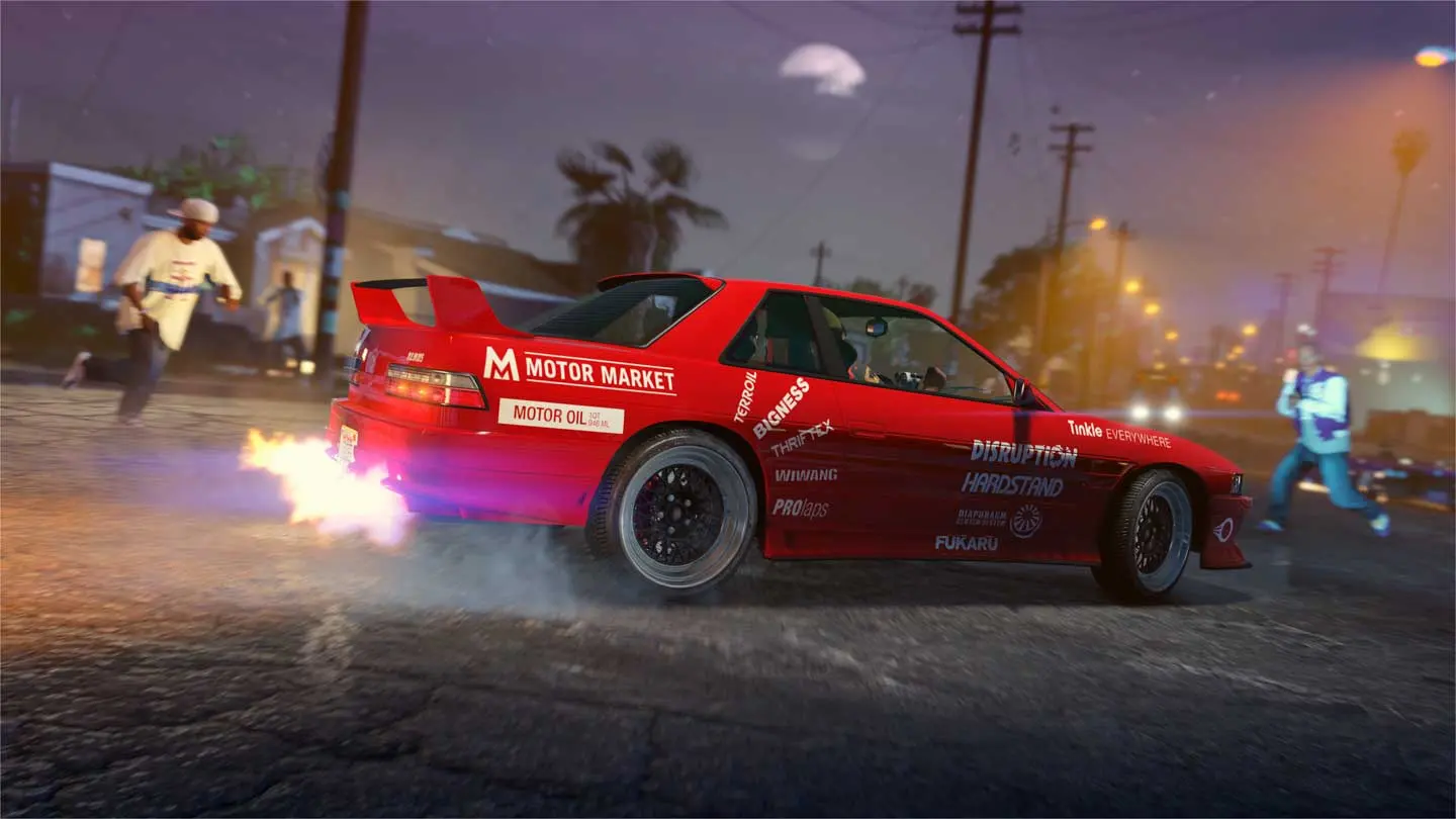 A red tuner sedan in sponsor liveries spits flames from its exhaust on a street at night.