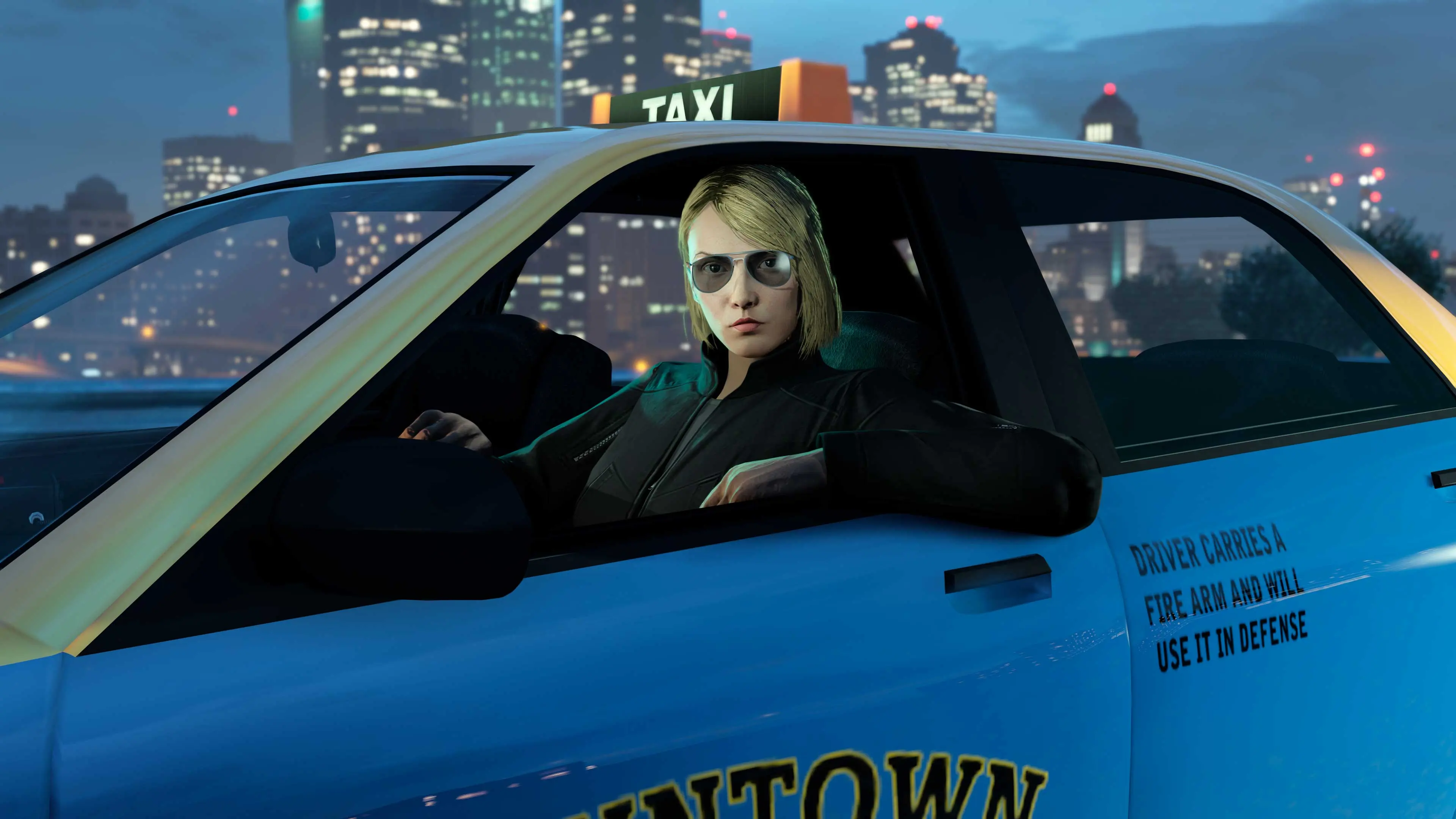 A driver in sunglasses behind the wheel of a Downtown Cab Co. taxi at night, with Los Santos skyscrapers behind.
